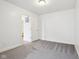 A bedroom featuring neutral gray carpet and white walls, creating a bright and inviting space at 5520 N Woodside Ct, McCordsville, IN 46055
