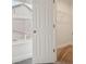 View of a bedroom closet with an open door, window, and wire shelving for organized storage at 5520 N Woodside Ct, McCordsville, IN 46055
