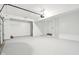 Well-lit, clean garage space with a white door and ample space for vehicles and storage at 5520 N Woodside Ct, McCordsville, IN 46055