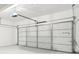 Clean, white garage with an automatic door, offering ample parking and storage space at 5520 N Woodside Ct, McCordsville, IN 46055