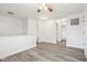 Bright living room with light gray floors and white walls, offering ample space and natural light at 5520 N Woodside Ct, McCordsville, IN 46055