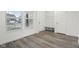Mud room features wood look floors, a window, bench and coat hooks, providing a functional entry space at 5520 N Woodside Ct, McCordsville, IN 46055