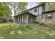 Exterior view of screened-in porch and well-maintained yard at 569 King Dr, Indianapolis, IN 46260