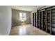 Bedroom with hardwood floors, bright window and built-in shelving at 569 King Dr, Indianapolis, IN 46260