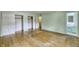 Bedroom with wood floors and access to a bathroom, offering ample closet space at 569 King Dr, Indianapolis, IN 46260