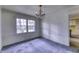 Dining room with a charming chandelier, large window and direct access to kitchen at 569 King Dr, Indianapolis, IN 46260