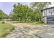 Wide driveway leading to a two-car garage of a quaint home at 569 King Dr, Indianapolis, IN 46260