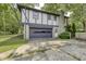 Charming two-story home with stone and siding exterior and attached garage at 569 King Dr, Indianapolis, IN 46260
