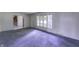 Bright living room featuring neutral carpeting and natural light at 569 King Dr, Indianapolis, IN 46260
