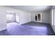 Open living room area connected to the dining room and stairs at 569 King Dr, Indianapolis, IN 46260