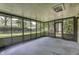 Enjoy a relaxing screened-in porch with views of the spacious back yard at 569 King Dr, Indianapolis, IN 46260