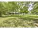 Expansive lawn and mature trees enhance this lovely home's curb appeal at 569 King Dr, Indianapolis, IN 46260