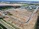 An aerial view shows the beginnings of a new development with streets and plots being laid out at 5908 Agogo Way, Greenwood, IN 46143