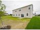 Spacious backyard with lush green lawn and home exterior views at 5908 Agogo Way, Greenwood, IN 46143
