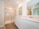 Modern bathroom with double vanity, marble counter tops, and glass-enclosed shower at 5908 Agogo Way, Greenwood, IN 46143
