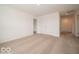 Bedroom with plush carpeting, closet, and access to an adjacent hallway and bedroom at 5908 Agogo Way, Greenwood, IN 46143