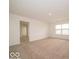 Spacious bedroom featuring natural light, plush carpeting and an en suite bathroom at 5908 Agogo Way, Greenwood, IN 46143