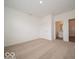 Spacious carpeted bedroom featuring access to a private bathroom and ample natural light at 5908 Agogo Way, Greenwood, IN 46143