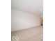 Spacious carpeted bedroom with neutral paint and access to attached bathroom at 5908 Agogo Way, Greenwood, IN 46143