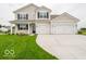 Charming two-story home with a well-maintained lawn and an attached two-car garage at 5908 Agogo Way, Greenwood, IN 46143