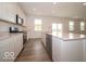 Well-equipped kitchen featuring stainless appliances, white cabinets and bar seating for casual dining at 5908 Agogo Way, Greenwood, IN 46143