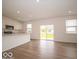 Modern kitchen with white cabinetry, stainless steel appliances, and large island with bar seating at 5908 Agogo Way, Greenwood, IN 46143