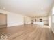 Spacious living room seamlessly flows into a modern kitchen with stainless steel appliances at 5908 Agogo Way, Greenwood, IN 46143