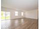 Spacious living area with sliding doors, hardwood floors and large windows at 5908 Agogo Way, Greenwood, IN 46143