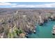 Expansive aerial shot of waterfront properties nestled among dense, bare trees at 6198 Grosbeak Dr, Nineveh, IN 46164
