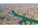 A stunning high angle aerial view of a waterfront community and tree lined streets at 6198 Grosbeak Dr, Nineveh, IN 46164