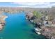 An aerial view of the real estate showcasing a lakefront setting with docks on the property at 6198 Grosbeak Dr, Nineveh, IN 46164