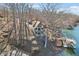 Aerial image captures the lakeside home with a dock and stairway to the water at 6198 Grosbeak Dr, Nineveh, IN 46164