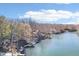 Scenic aerial view of lakefront homes with private docks on a sunny day at 6198 Grosbeak Dr, Nineveh, IN 46164