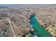 A breathtaking, high angle aerial view showcasing the waterfront real estate with many docks and trees at 6198 Grosbeak Dr, Nineveh, IN 46164