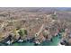 Serene aerial scenery shows lakefront homes with docks among dense trees at 6198 Grosbeak Dr, Nineveh, IN 46164