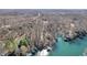 Breathtaking aerial perspective of lake homes surrounded by wooded landscapes at 6198 Grosbeak Dr, Nineveh, IN 46164