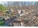 Aerial image showcases a lakefront home with terraced yard, dock, and beautiful lake views at 6198 Grosbeak Dr, Nineveh, IN 46164