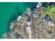 Scenic aerial showing lake houses with docks surrounded by barren trees at 6198 Grosbeak Dr, Nineveh, IN 46164