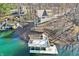 Beautiful aerial perspective of waterfront home, wooden dock, and lush treed landscape at 6198 Grosbeak Dr, Nineveh, IN 46164