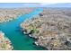 Picturesque aerial shot of a meandering lake surrounded by wooded homes at 6198 Grosbeak Dr, Nineveh, IN 46164