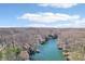 Scenic aerial of lakefront homes and docks nestled among dense trees at 6198 Grosbeak Dr, Nineveh, IN 46164