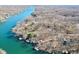 Scenic aerial view displays waterfront homes with boat docks nestled along the tranquil lake at 6198 Grosbeak Dr, Nineveh, IN 46164