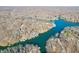 Stunning aerial view showcasing the expansive lake with waterfront homes nestled along the shore and vibrant trees at 6198 Grosbeak Dr, Nineveh, IN 46164