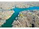 Breathtaking aerial view of the lake featuring homes nestled among trees and docks along the picturesque shoreline at 6198 Grosbeak Dr, Nineveh, IN 46164