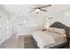 Comfortable bedroom featuring a ceiling fan, peaked ceiling and lake view at 6198 Grosbeak Dr, Nineveh, IN 46164