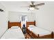 Bright bedroom featuring two beds, a ceiling fan, and a lakeside view at 6198 Grosbeak Dr, Nineveh, IN 46164