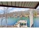 Stunning lake view featuring a private dock and clear blue water surrounded by lush trees at 6198 Grosbeak Dr, Nineveh, IN 46164