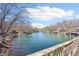 Picturesque lake view featuring waterfront homes with boat docks and scenic blue water on a sunny day at 6198 Grosbeak Dr, Nineveh, IN 46164
