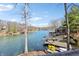 Expansive lake view showcasing waterfront homes, docks, and vibrant blue water on a sunny day at 6198 Grosbeak Dr, Nineveh, IN 46164
