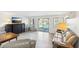 Bright living room with lake views, comfortable seating, and sliding glass doors to the outside at 6198 Grosbeak Dr, Nineveh, IN 46164